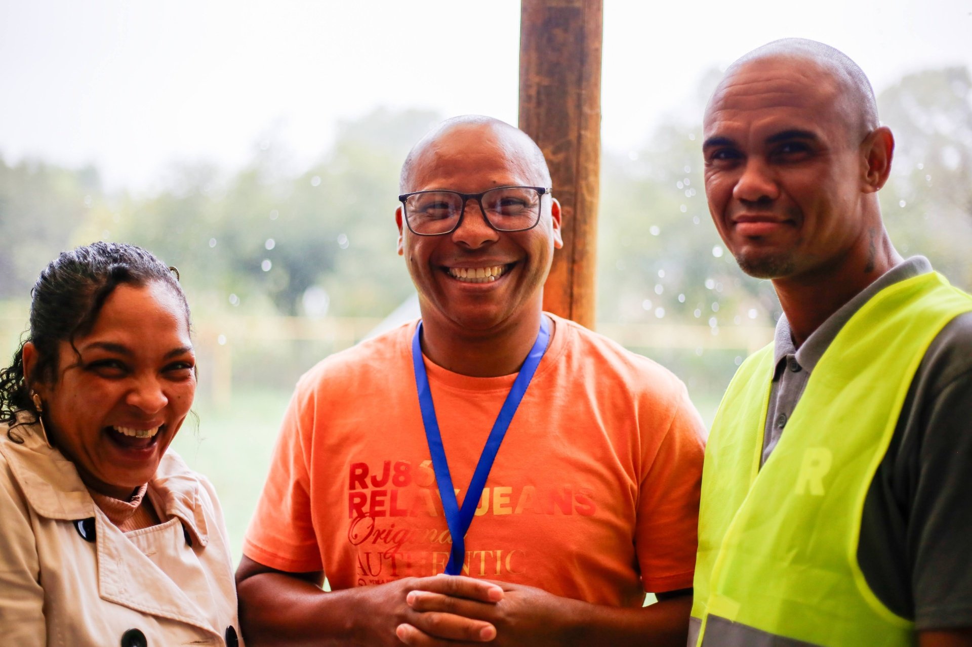 Three friends laughing together at REIGN Church community time