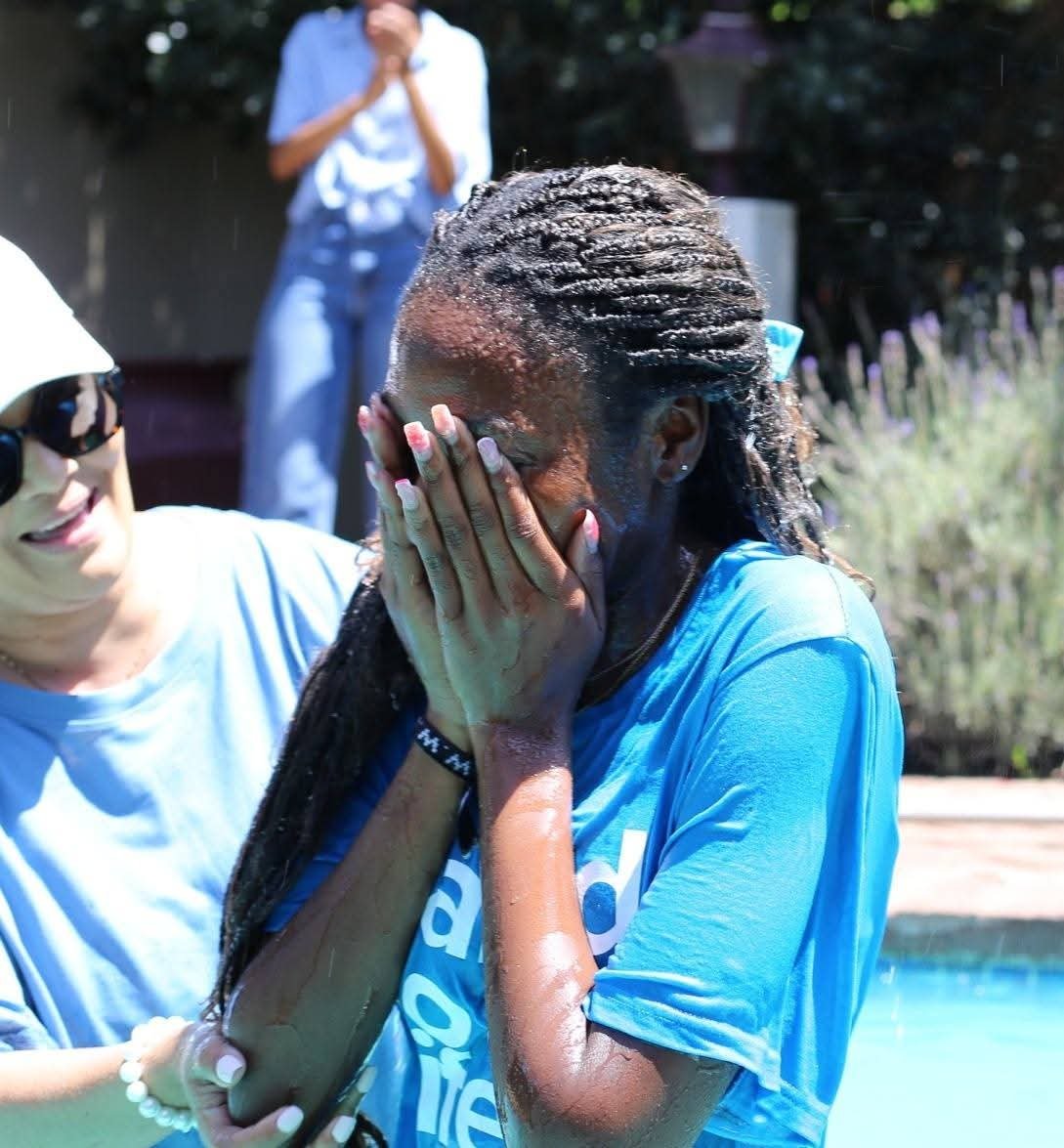 Believer weeping with joy after being baptised in water at REIGN Church Bloemfontein